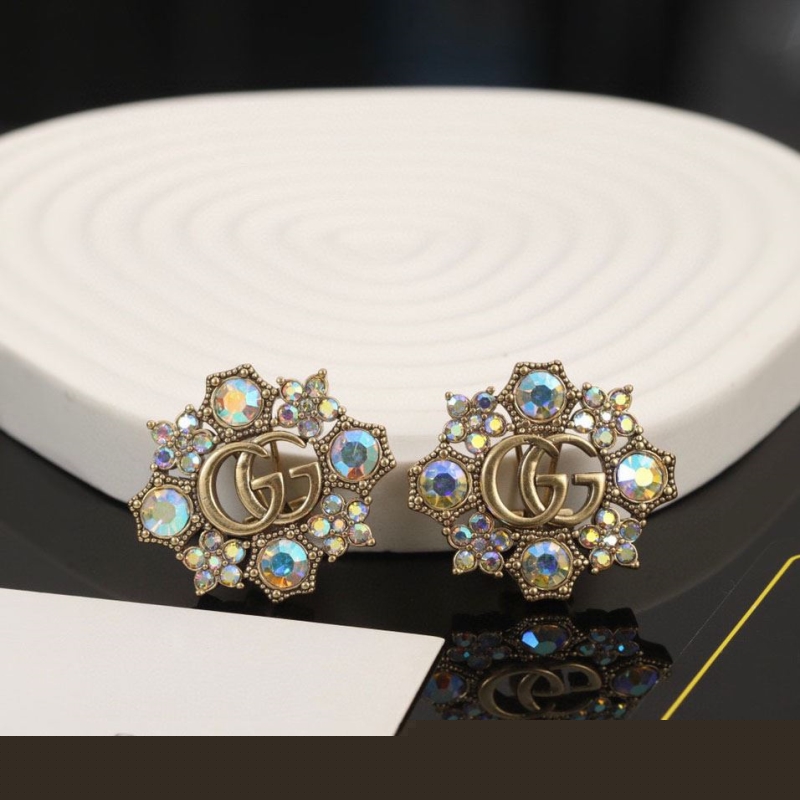 G*u*i earrings